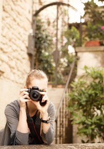 Young female traveler photographer