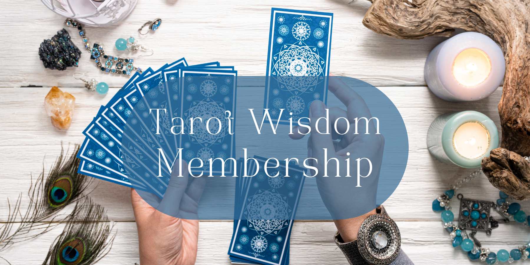 tarot wisdom membership Deck of Tarot Cards on a white table top with candles and driftwood, Tarot Wisdom Manifesting